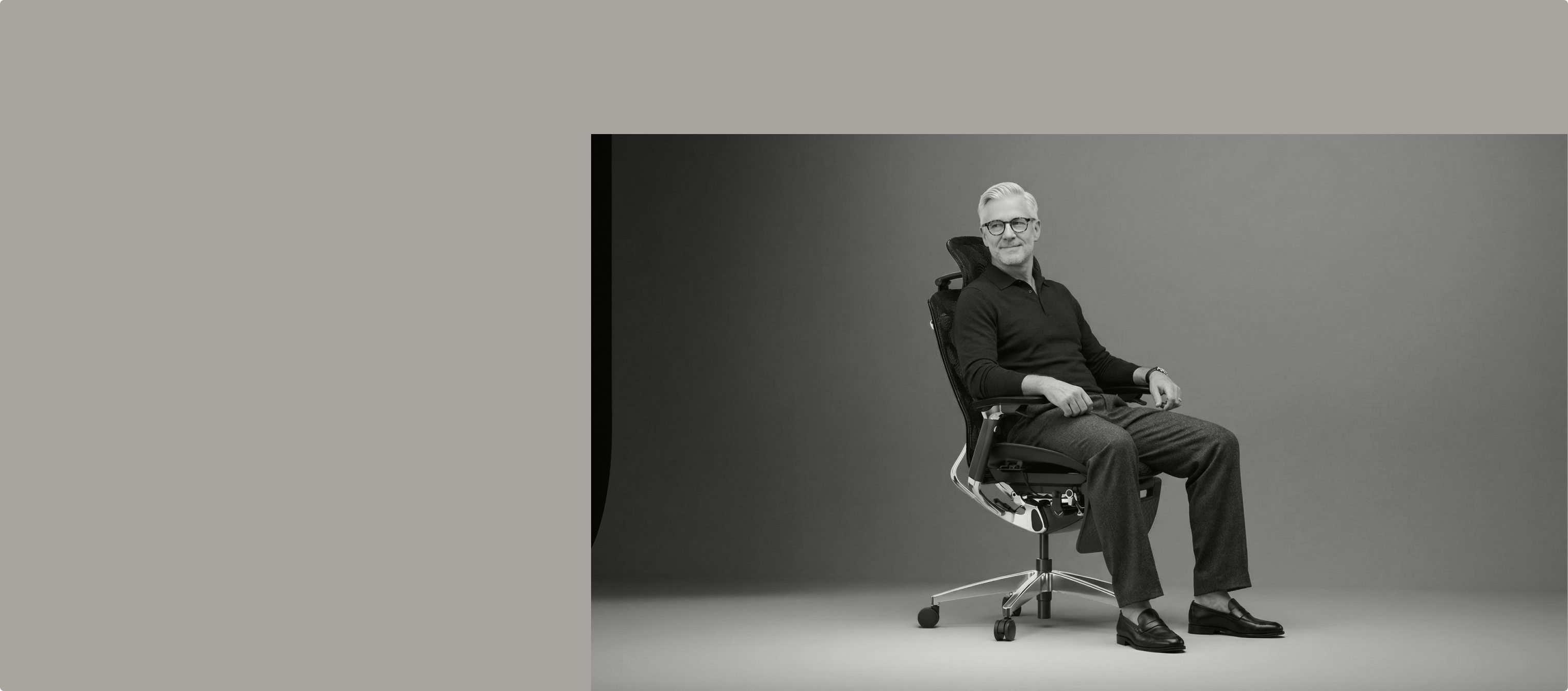 An old man sitting on the ergonomic chair Apollo