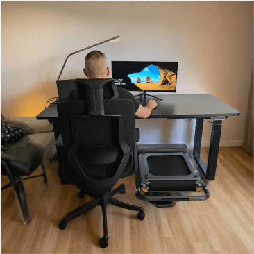 FlexiSpot E7Q Odin 4-leg electric height adjustable standing desk in a home work and gaming setup, shared by @naturally_frenchy