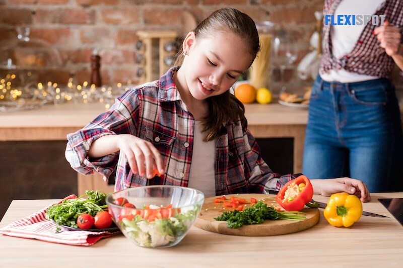 Girl cuts vegie chef dinner ingredients healthy food